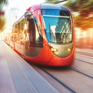 blurred background focus in on red train/tram