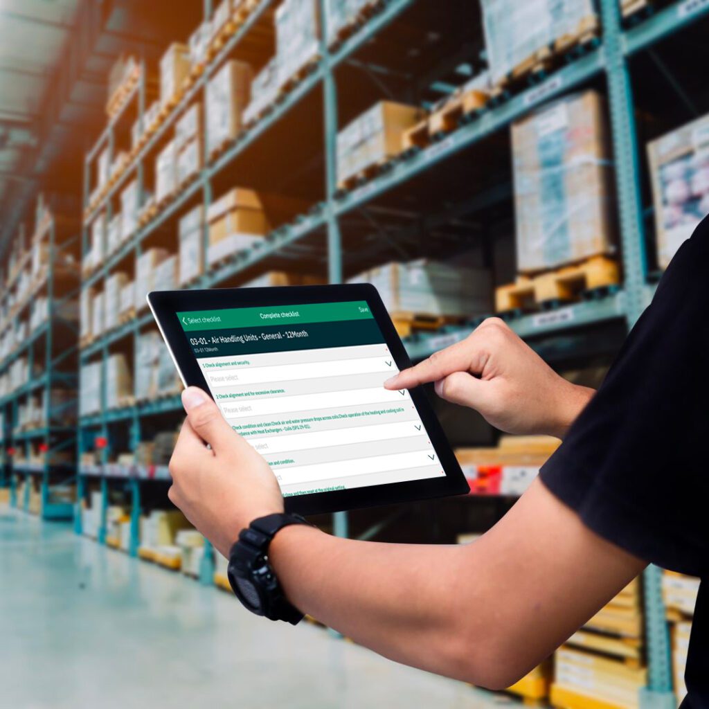 man on tablet in warehouse